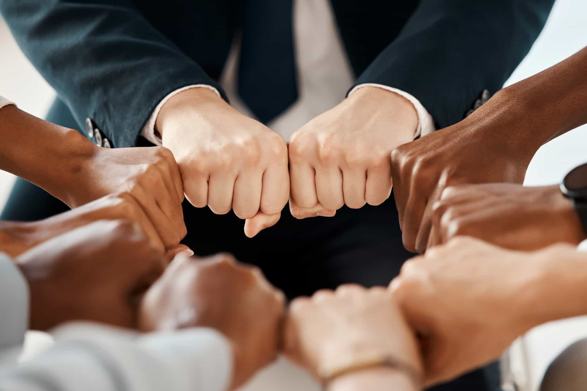 Fist, diversity and solidarity, support and collaboration, team trust and community in workplace. B